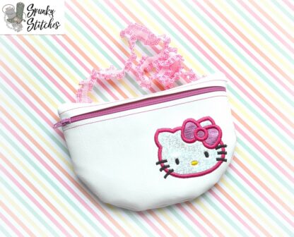 kitty clutch zipper bag in the hoop embroidery design by spunky stitches