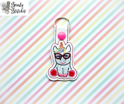 nerdy unicorn key fob in the hoop embroidery file by spunky stitches