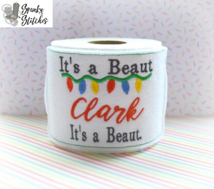 She's a beaut toilet paper wrap in the hoop embroidery file by spunky stitches