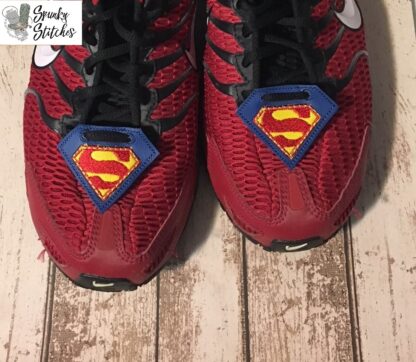 superman shoe tags in the hoop embroidery file by spunky stitches