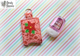 Poinsettia hand sanitizer key fob in the hoop embroidery file by spunky stitches