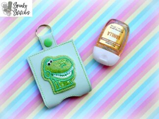 Rex Hand Sanitizer Holder Key Fob in the hoop embroidery file by Spunky stitches